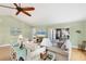 Spacious living area featuring comfortable seating, an entertainment center, and access to the outdoor patio at 3443 Tallywood Cir # 7061, Sarasota, FL 34237