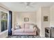 Bright sitting room with a large window, comfortable sofa, and decorative rug at 3443 Tallywood Cir # 7061, Sarasota, FL 34237