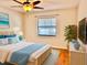 Serene main bedroom with hardwood floors, ceiling fan and a comfortable bed at 4127 3Rd Ave W, Palmetto, FL 34221