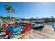 Waterfront home with private dock and multiple seating options for sitting or fishing at 4419 Mangrove Point Rd, Bradenton, FL 34210