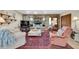 Cozy living room features a decorative stone wall, plush seating, and natural light creating a welcoming atmosphere at 4419 Mangrove Point Rd, Bradenton, FL 34210
