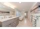 Bright bathroom featuring double vanity with marble countertop, soaking tub and separate glass shower at 4510 Banan Pl, Sarasota, FL 34242