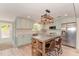 Well-equipped kitchen with stainless steel appliances, center island, and ample cabinet space at 4510 Banan Pl, Sarasota, FL 34242