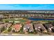 Stunning aerial view of home on the golf course with a lake and other homes nearby at 4745 Benito Ct, Lakewood Ranch, FL 34211