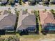 An aerial view showcasing the home's well-maintained landscaping and private backyard, including a screened pool enclosure at 4745 Benito Ct, Bradenton, FL 34211