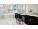 Luxurious bathroom with dual vanities, a soaking tub, glass shower, and plenty of counter space at 4745 Benito Ct, Lakewood Ranch, FL 34211