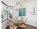 Bright breakfast nook with a unique light fixture and view of the backyard at 4745 Benito Ct, Lakewood Ranch, FL 34211