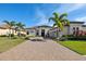 Beautiful one-story home featuring well-manicured landscaping and a neutral color scheme at 4745 Benito Ct, Lakewood Ranch, FL 34211