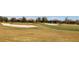 Scenic golf course view featuring sand traps and well-maintained grass, with homes in the background at 4745 Benito Ct, Lakewood Ranch, FL 34211