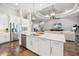 Open-concept kitchen with modern appliances, a large island, and stylish pendant lighting at 4745 Benito Ct, Lakewood Ranch, FL 34211