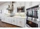 Gourmet kitchen featuring stainless steel appliances and sleek, white cabinetry at 4745 Benito Ct, Lakewood Ranch, FL 34211