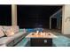 Outdoor living space with comfortable seating, a modern fire pit, and a view of the pool at 4745 Benito Ct, Lakewood Ranch, FL 34211