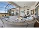 Outdoor patio featuring a fire pit, comfortable seating, and a scenic view of the surrounding landscape at 4745 Benito Ct, Lakewood Ranch, FL 34211