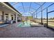 Expansive outdoor patio with a pool, outdoor kitchen, and seating areas, perfect for entertaining and relaxation at 4745 Benito Ct, Lakewood Ranch, FL 34211