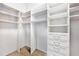 Walk-in closet with built-in shelving and drawers offers plenty of room for storage at 4745 Benito Ct, Lakewood Ranch, FL 34211