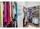 Organized walk-in closet featuring white shelving, drawers, and hanging rods for clothes and shoes at 4745 Benito Ct, Lakewood Ranch, FL 34211