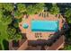Aerial view of community pool, jacuzzi, and seating at 531 Latitude Ln, Osprey, FL 34229