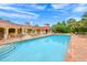 Large community pool with plenty of seating and a covered lounge area at 531 Latitude Ln, Osprey, FL 34229