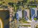 Aerial shot featuring a home with pool, adjacent to a pond at 5561 Burnt Branch Cir, Sarasota, FL 34232