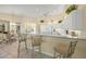 Open concept kitchen with breakfast bar seating, bright lighting and updated appliances at 557 Marsh Creek Rd, Venice, FL 34292