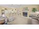 Open floor plan showcasing living room flowing into the kitchen with breakfast bar at 557 Marsh Creek Rd, Venice, FL 34292