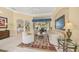 Cozy living room featuring tile floors, comfortable seating, and an open layout at 557 Marsh Creek Rd, Venice, FL 34292