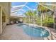 Sparkling screened pool and patio area, perfect for outdoor entertaining and relaxation at 557 Marsh Creek Rd, Venice, FL 34292