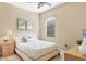 Serene bedroom featuring neutral tones, a plush bed, and a ceiling fan with lighting at 9214 Raes Creek Pl, Palmetto, FL 34221