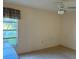 Cozy bedroom with a window overlooking the neighborhood at 1546 Grand Blvd # 108, Sarasota, FL 34232
