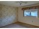 Bedroom featuring a window with natural light at 1546 Grand Blvd # 108, Sarasota, FL 34232