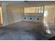 Spacious living room with a partial wall and neutral color scheme at 1546 Grand Blvd # 108, Sarasota, FL 34232