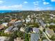 Panoramic aerial of this home in a serene, tree-lined neighborhood with easy access to the beautiful waterfront at 1746 Stapleton St, Sarasota, FL 34239
