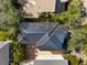 Aerial view of this home showcasing its unique roof design and its location within a vibrant, green community at 1746 Stapleton St, Sarasota, FL 34239