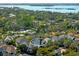 Aerial view of this home surrounded by lush greenery, nestled in a peaceful residential area near the bay at 1746 Stapleton St, Sarasota, FL 34239