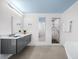 Sleek bathroom featuring marble shower and gray vanity at 1746 Stapleton St, Sarasota, FL 34239