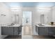 Dual vanity bathroom featuring marble countertops, modern fixtures, and natural light at 1746 Stapleton St, Sarasota, FL 34239