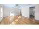 Bedroom with hardwood floors, large windows, and an attached bathroom with a modern tub at 1746 Stapleton St, Sarasota, FL 34239