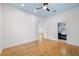 Bedroom with hardwood floors, blue ceiling and ensuite bathroom with a double door entry at 1746 Stapleton St, Sarasota, FL 34239