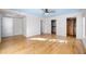 Spacious bedroom with hardwood floors, large windows, and multiple closets offering storage space at 1746 Stapleton St, Sarasota, FL 34239
