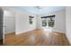 Bright bedroom with hardwood floors, large windows providing ample natural light, and a spacious closet at 1746 Stapleton St, Sarasota, FL 34239