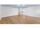 Bonus room featuring wood floors, ample natural light, and a versatile open space for various activities at 1746 Stapleton St, Sarasota, FL 34239