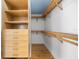 Walk-in closet with custom wood shelving and drawers at 1746 Stapleton St, Sarasota, FL 34239
