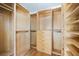Walk-in closet with hanging rods, shelving, and built-in drawers at 1746 Stapleton St, Sarasota, FL 34239