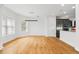Bright dining area with hardwood floors and views into the modern kitchen at 1746 Stapleton St, Sarasota, FL 34239