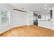 Dining Area featuring hardwood floors, a modern light fixture, and kitchen view at 1746 Stapleton St, Sarasota, FL 34239