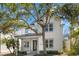 Charming two-story home featuring manicured landscaping, a welcoming porch, and a well-maintained front yard at 1746 Stapleton St, Sarasota, FL 34239