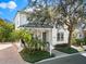 Beautiful two-story home with a welcoming front porch, mature landscaping, and a well-maintained exterior at 1746 Stapleton St, Sarasota, FL 34239