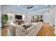 Stylishly furnished living room with hardwood floors and a large sectional couch at 1746 Stapleton St, Sarasota, FL 34239