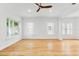 Well-lit living room featuring hardwood floors, multiple windows, and modern decor at 1746 Stapleton St, Sarasota, FL 34239