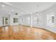 Bright, spacious living area featuring hardwood floors, recessed lighting, and multiple windows at 1746 Stapleton St, Sarasota, FL 34239